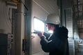 Engineer repairing an unloading gate