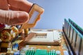 Engineer repairman holding chip CPU to insert into the socket of computer motherboard. Concept of technology hardware