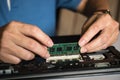 The engineer repairs the laptop pc, computer and the motherboard. Royalty Free Stock Photo