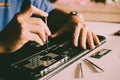 The engineer repairs the laptop pc, computer and the motherboard. Royalty Free Stock Photo