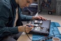 Engineer restores the laptop PC. Electronic repair shop, technology renovation