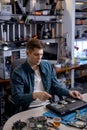 Engineer restores the laptop PC. Electronic repair shop, technology renovation