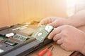 Engineer restores the laptop PC. Installing the hard drive hardware, RAM. Electronic repair shop, technology renovation