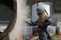 Engineer sandblasting a steel casing Royalty Free Stock Photo