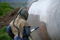 Engineer sandblasting a steel casing