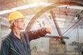 Engineer senior mananger worker looking at wristwatch overlay time clock face. Industry factory working hours concept Royalty Free Stock Photo