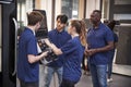 Engineer Showing Apprentices How To Use CNC Tool Making Machine Royalty Free Stock Photo