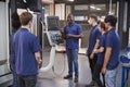 Engineer Showing Apprentices How To Use CNC Tool Making Machine Royalty Free Stock Photo