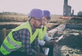 Engineer sitting at construction site and thinking