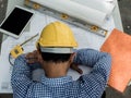 Engineer sleeps on the table while working