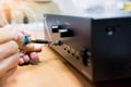 Engineer soldering audio cable, Repair and adjustment of the equipment,copy space Royalty Free Stock Photo