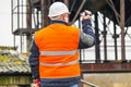 Engineer on the stairs filmed with camcorder in factory Royalty Free Stock Photo