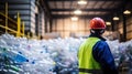 Engineer Standing and looking back The plastic bottle in the recycling industry