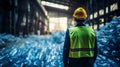 Engineer Standing and looking back The plastic bottle in the recycling industry. Neural network ai generated Royalty Free Stock Photo