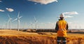 Engineer standing at the wind turbine plant.