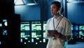 Engineer strolling through data center