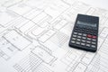 Engineer table with schematics and calculator Royalty Free Stock Photo