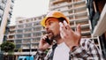 Engineer talking on phone. Architect using phone on construction site. Foreman phone call control process. Construction worker Royalty Free Stock Photo