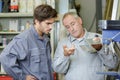 engineer teaching apprentice to use factory machine Royalty Free Stock Photo