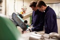 Engineer Teaching Apprentice To Use Grinding Machine Royalty Free Stock Photo