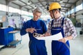 Engineer Teaching Apprentices To Use Computerized cnc metal processing machines Royalty Free Stock Photo