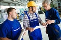 Engineer Teaching Apprentices To Use Computerized cnc metal processing machines Royalty Free Stock Photo