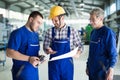 Engineer Teaching Apprentices To Use Computerized cnc metal processing machines Royalty Free Stock Photo