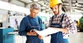 Engineer Teaching Apprentices To Use Computerized cnc metal processing machines Royalty Free Stock Photo