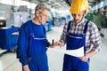 Engineer Teaching Apprentices To Use Computerized cnc metal processing machines Royalty Free Stock Photo