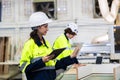 engineer team staff worker working in wooden furniture factory control operate wood cutter machine Royalty Free Stock Photo