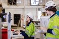 engineer team staff worker working in wooden furniture factory control operate wood cutter machine Royalty Free Stock Photo