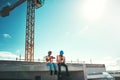 Engineer, team and talking on building roof at construction site about break time, development or architecture. Black Royalty Free Stock Photo