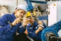 Engineer team worker fix service replace broken part of automatic industry robotic welding arm. staff repair maintenance robot Royalty Free Stock Photo