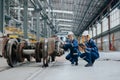 Engineer team working maintenance service fix replace train wheel in locomotive train repair depot