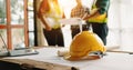 Engineer teams meeting working together wear worker helmets hardhat on construction site in modern city.Asian industry Royalty Free Stock Photo