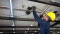 Engineer technical service checking solar panel while using walkie talkie for communicate with co worker to check the system of