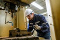 Engineer technician checking and controlling robotic arms at industrial factory Royalty Free Stock Photo