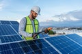 engineer technician checking output voltage level of inverter, electrician measuring power on solar panels Royalty Free Stock Photo