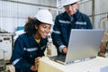 Engineer technician controlling robotic arms on computer laptop Royalty Free Stock Photo