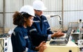 Engineer technician controlling robotic arms on computer laptop Royalty Free Stock Photo