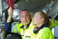 Engineer and technician repairing aircraft Royalty Free Stock Photo