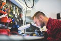 IT engineer technician repairing computer in electronics service shop