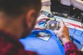 IT engineer technician repairing computer in electronics service shop