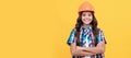 Engineer teenager girl. happy child with curly hair in construction helmet, contractor. Child builder in helmet