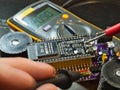 Engineer testing microcontroller board. Royalty Free Stock Photo