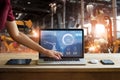 Engineer touching laptop check and control welding robotics