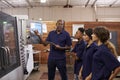 Engineer Training Apprentices On CNC Machine Royalty Free Stock Photo