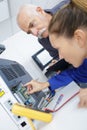 Engineer training female apprentice on cnc machine Royalty Free Stock Photo