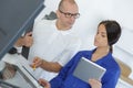 Engineer training female apprentice on cnc machine Royalty Free Stock Photo