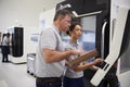 Engineer Training Female Apprentice To Use CNC Machine In Factor Royalty Free Stock Photo